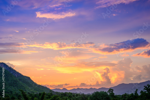 Majestic sunset in the mountains landscape. Overcast sky. © wuttichok