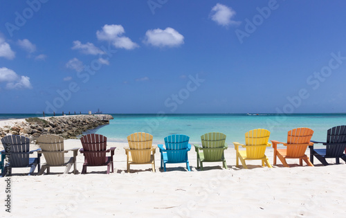 Colorful beach chairs on Caribbean coast in Aruba © elvirkin