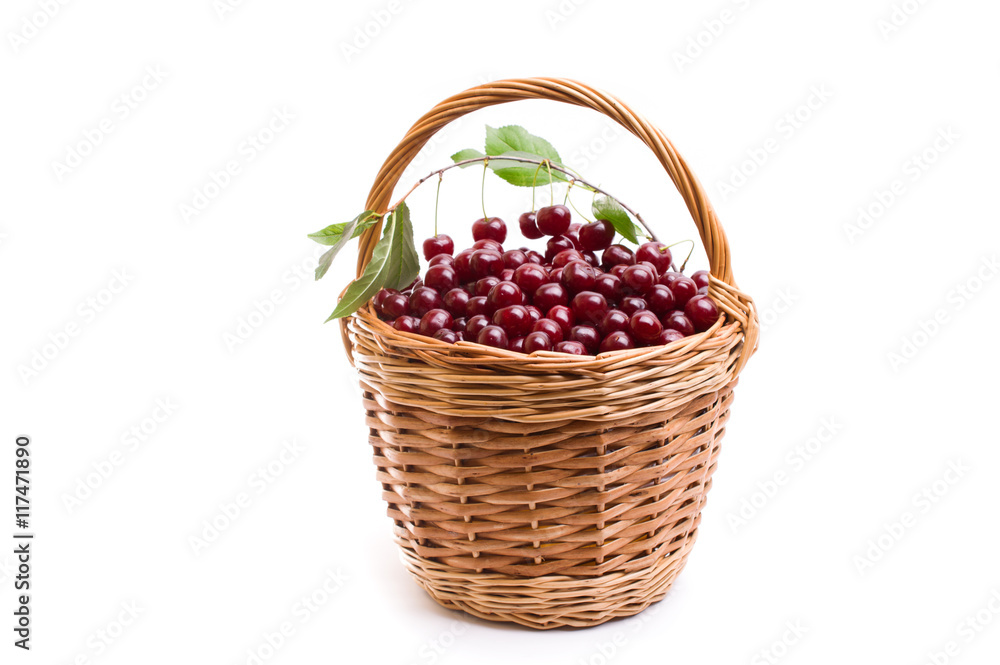 Basket full of fresh red cherry on a white background Basket full of fresh red cherry on a white background