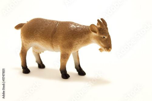 Goat toy made of plastic on a white background. photo