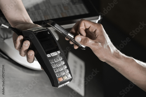 Wallpaper Mural Payment in a trade with nfc system credit card.Customer paying Torontodigital.ca