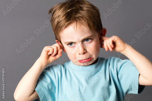 unhappy young child not willing to listen to domestic violence