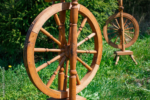 Old wooden spinning swirling amid the green park