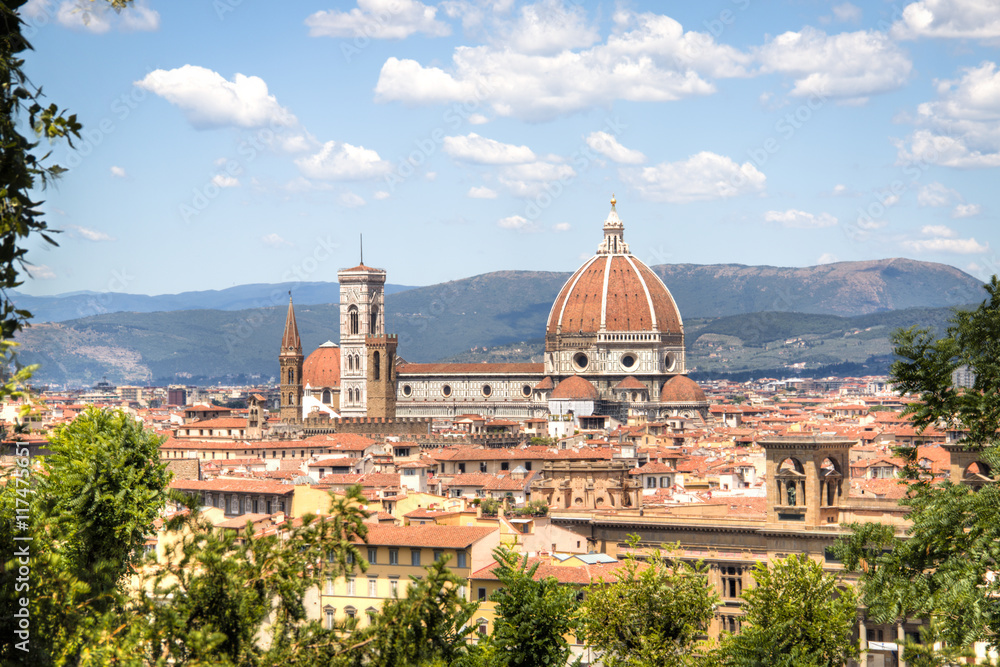 Magnificent view over the historical center of Florence in Italy. The photo is taken from piazzale Michelangelo and shows the Arno river, the Duomo and many other churches and buildings
