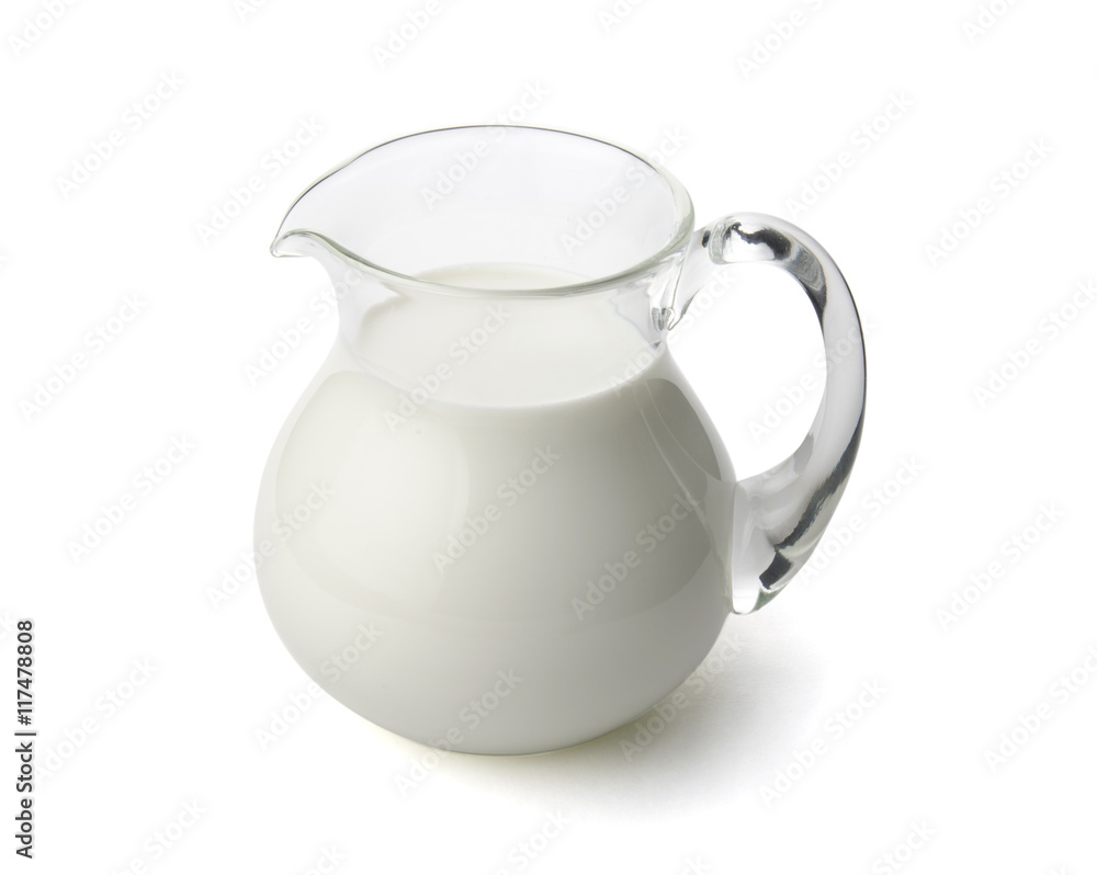 Milk in a glass jug isolated with clipping path. Milk in a glass jug isolated with clipping path.
