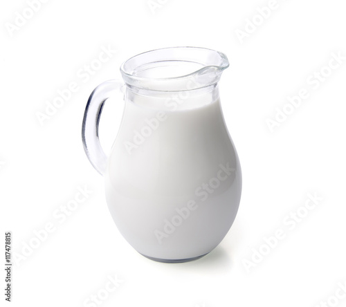 Milk in a glass jug isolated with clipping path.