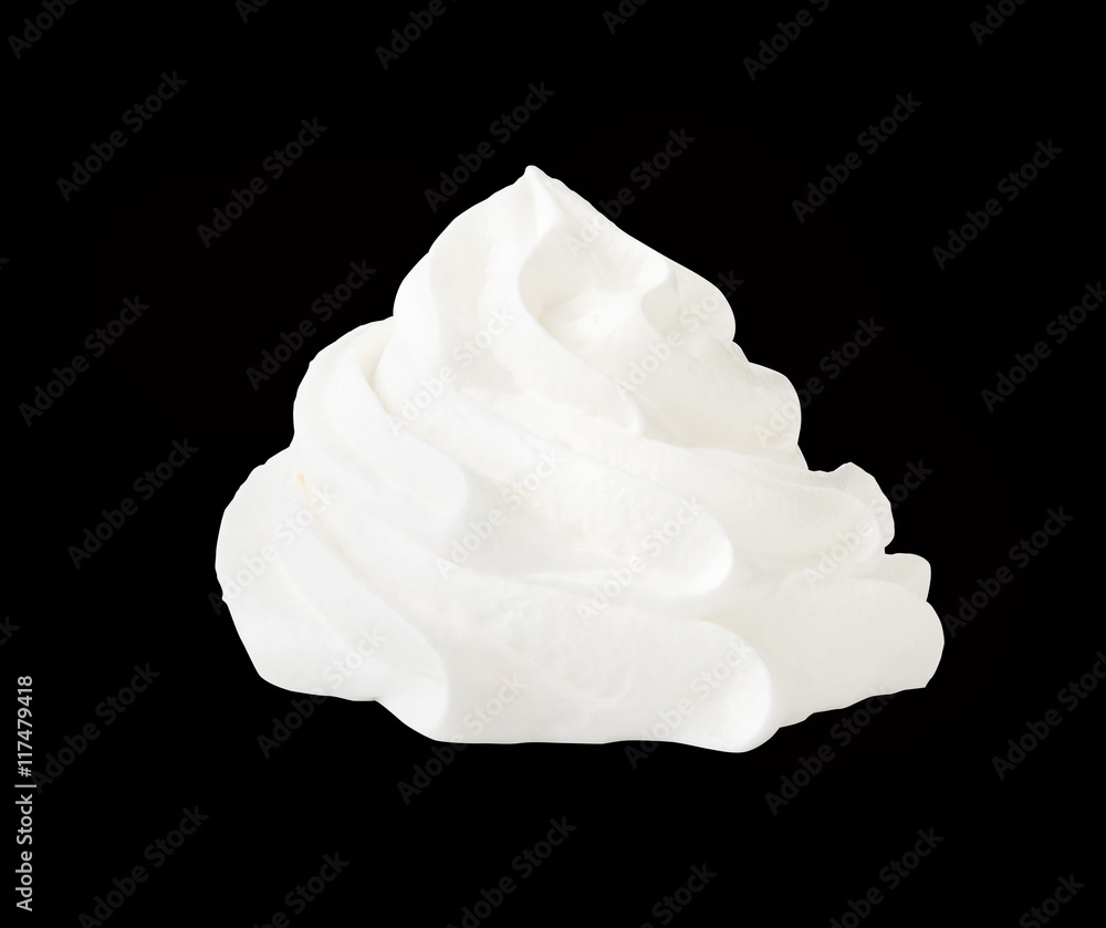 Whipped cream isolated on a black background with clipping path. Front view. Whipped cream isolated on a black background with clipping path. Front view.