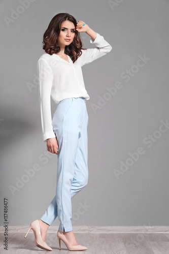 Pretty woman on grey backgr...