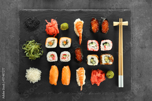 Sushi set and chopsticks on slate plate