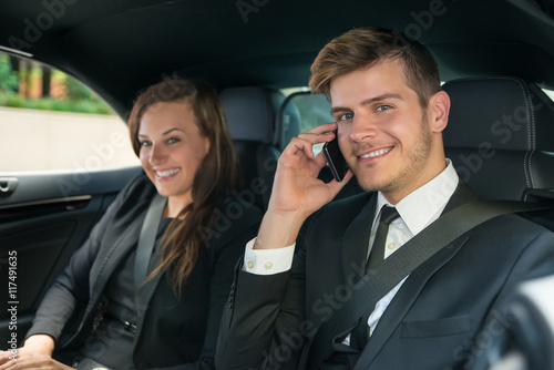 Happy Young Businessman And Businesswoman In The Car © Andrey Popov