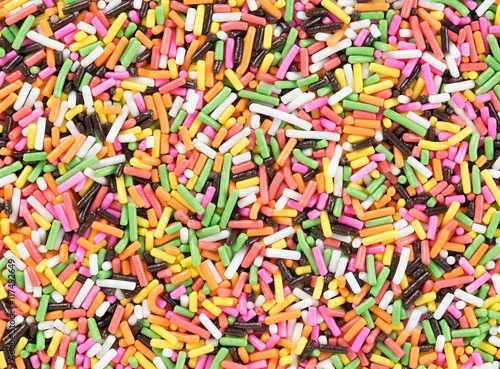 Colorful candy sprinkles background. Top view