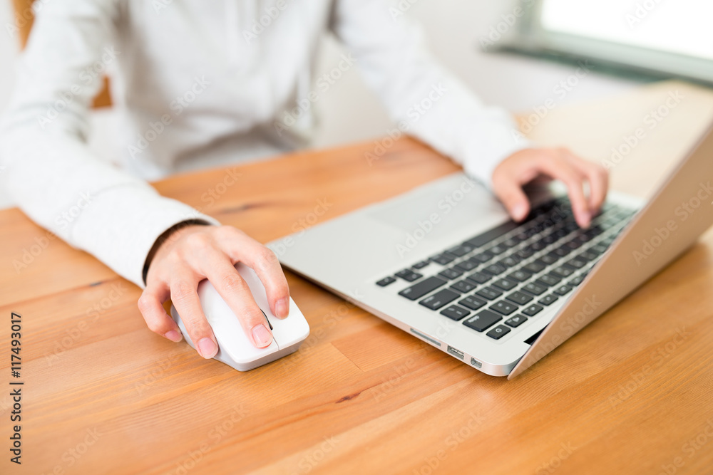 Woman using notebook computer at home Woman using notebook computer at home