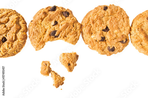 Coockies with nuts and chocolate pieces isolated on white background - close up image.