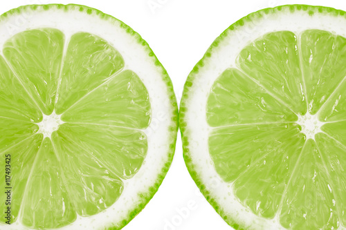 Fresh cut lime fruit isolated on white background - close up image.