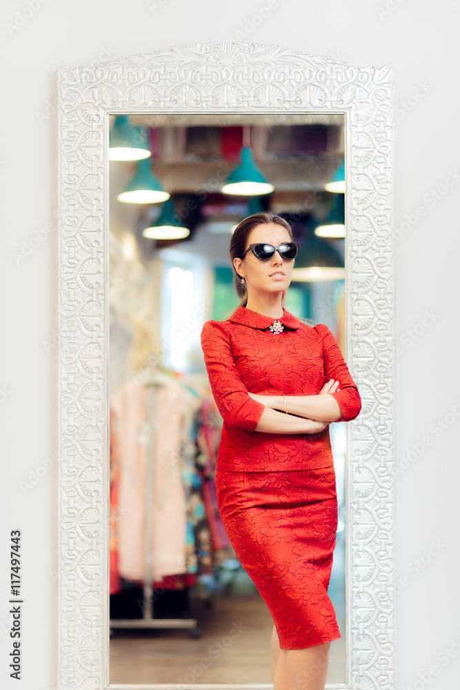 Fototapeta premium Woman in Red Suit in Fashion Store
