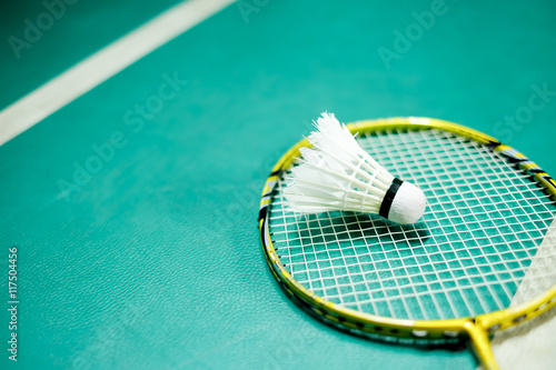 Shuttlecock on badminton playing court  