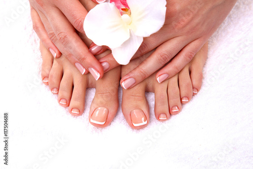 pedicure on legs and beautiful manicure  hands closeup