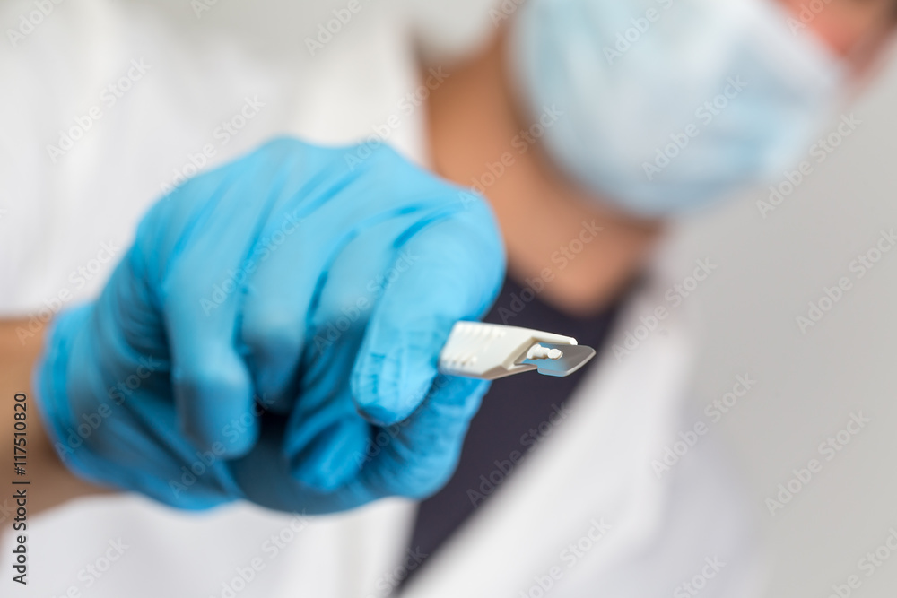 surgeon with a sharp scalpel in his hands surgeon with a sharp scalpel in his hands