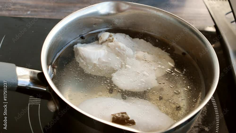 Boiling chicken stock in cooker Boiling chicken stock in cooker