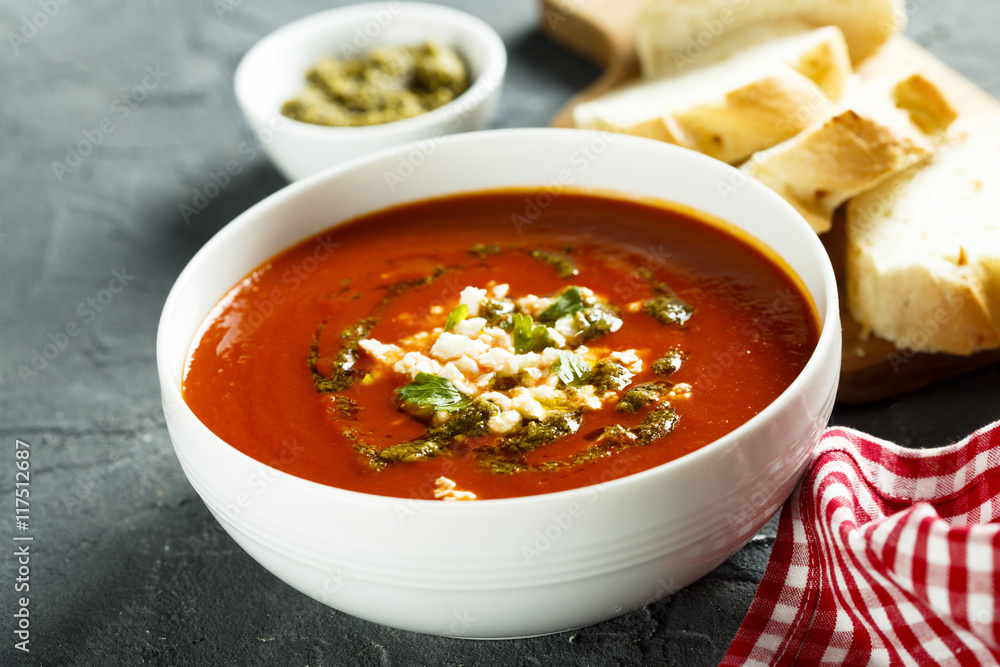 Tomato soup with cheese and pesto sauce Tomato soup with cheese and pesto sauce