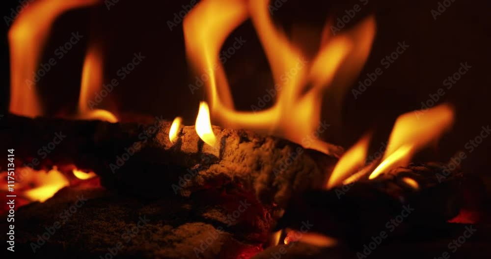 close up flames in a fireplace with wood coal close up flames in a fireplace with wood coal