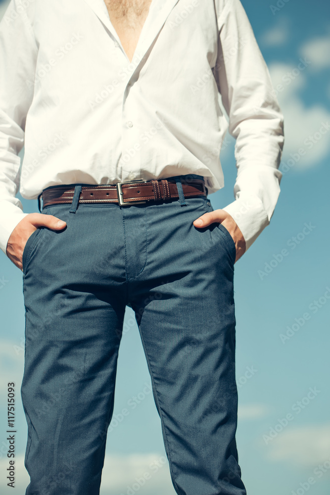 Man with hands in pockets