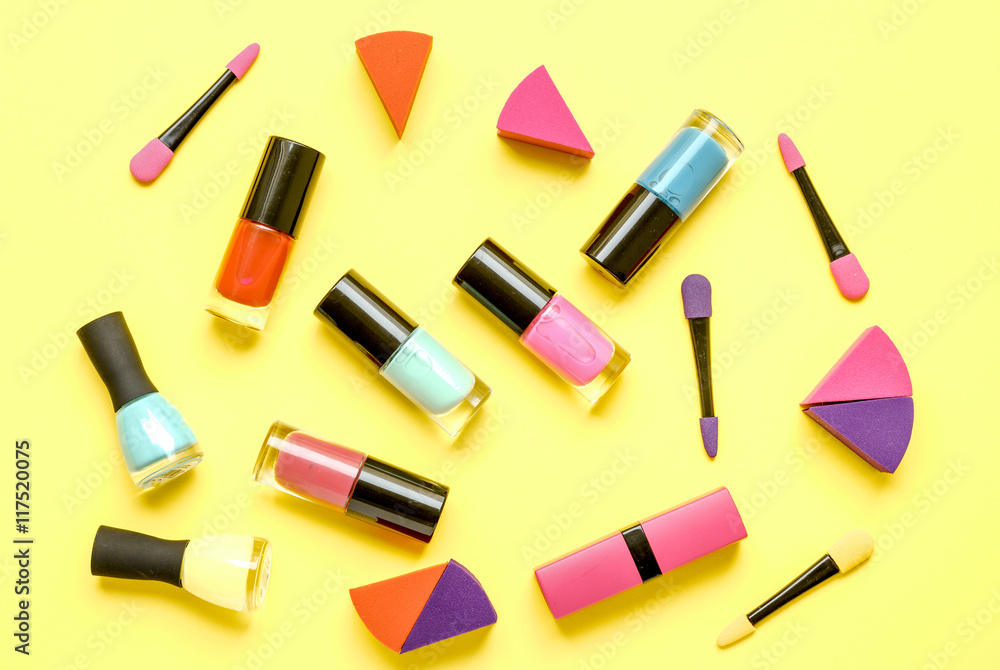 Obraz premium make up set on yellow background top view