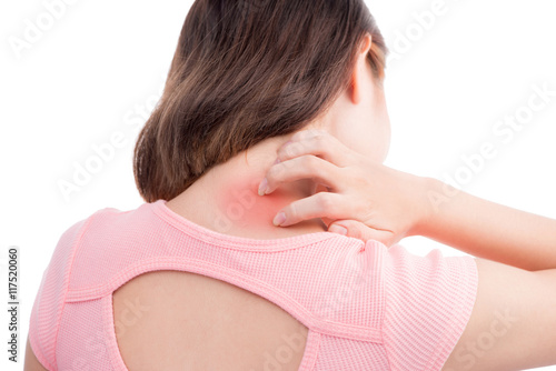 Asian woman with pain in her neck and shoulder, Isolated over wh