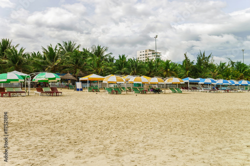 Palm shelters and people at China Beach in Danang