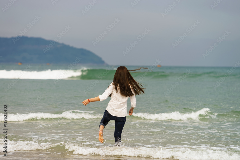 Young girl on the China Beach in Danang Vietnam