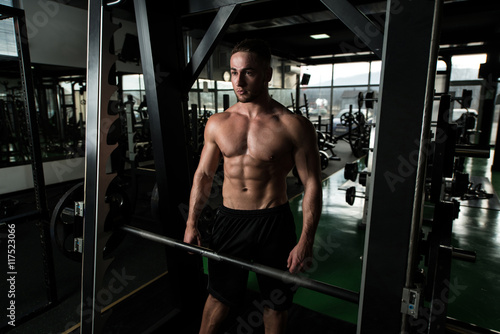 Young Bodybuilder Flexing Muscles