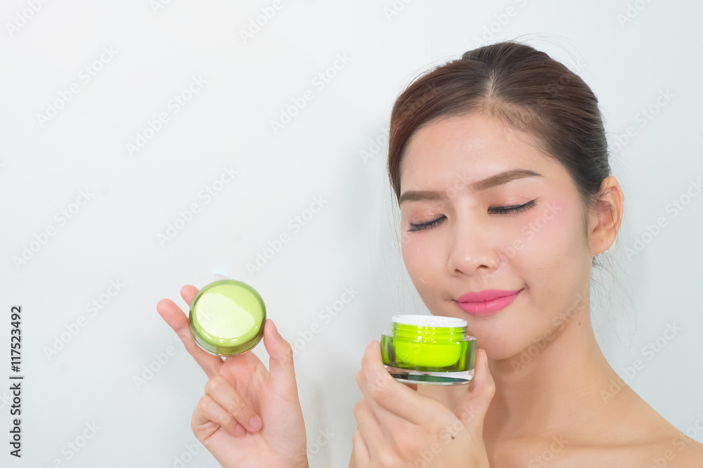 beautiful asian woman using a natural skin care product, moistur beautiful asian woman using a natural skin care product, moistur