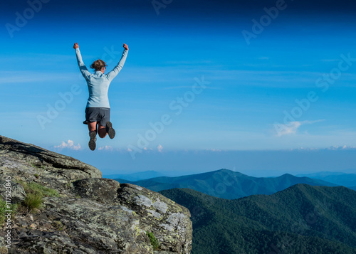 Leaping for Joy from a Rocky Overlook
