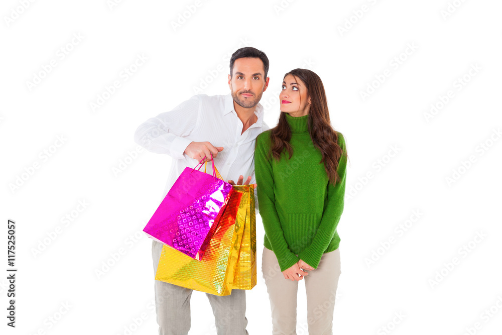 Happy woman looking at man carrying shopping bags Happy woman looking at man carrying shopping bags