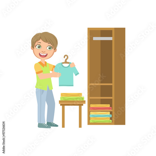 Boy Putting Clean Clothes In Dresser