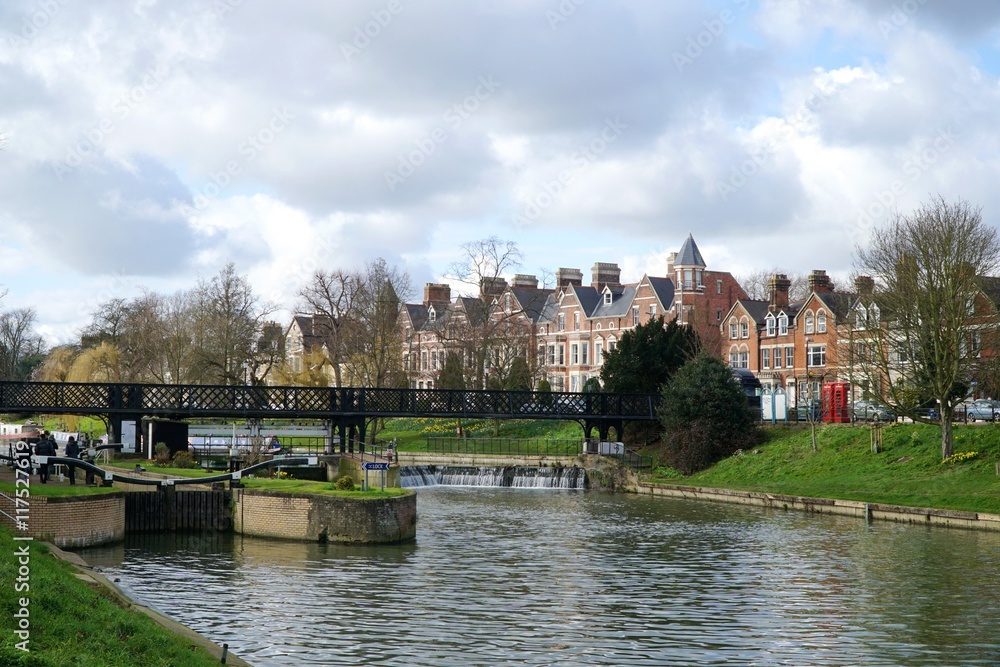 A view of Chesterton Road and the lock, weir and pedestrian footbridge near Jesus Green in Cambridge, UK.