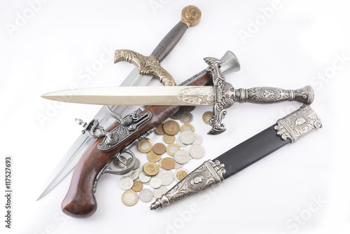 Old military daggers, gun and coins