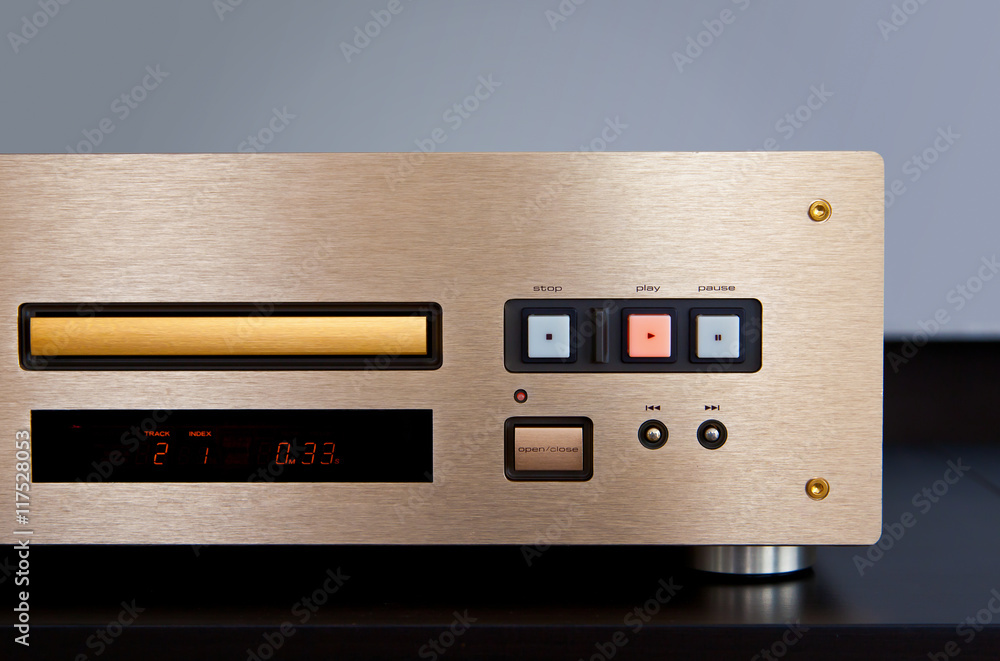 Fototapeta premium Expensive CD Player Playing Music with Golden Front Panel