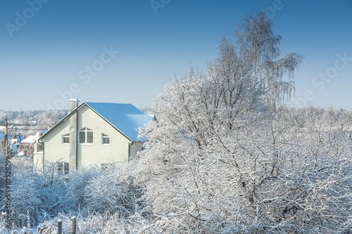 Country houses after snowfall