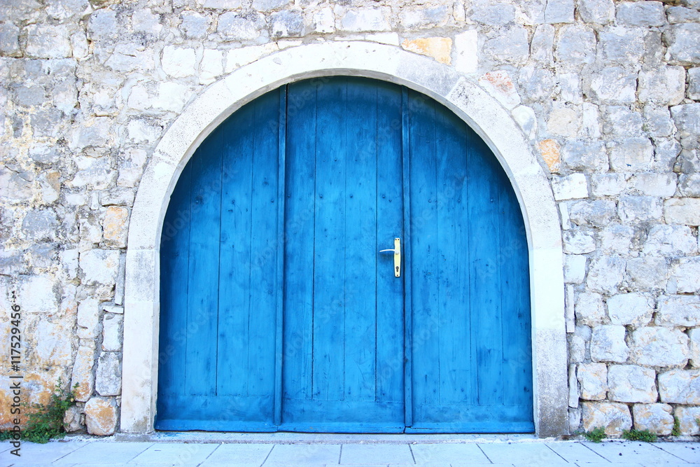 Old wooden door in blue color 