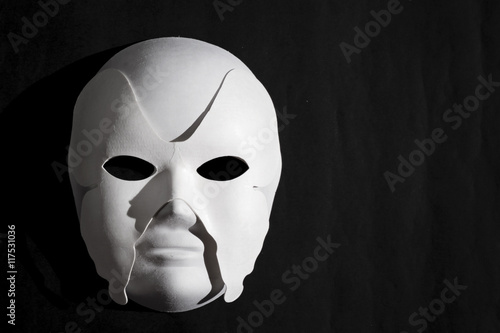 White Venetian mask and black background