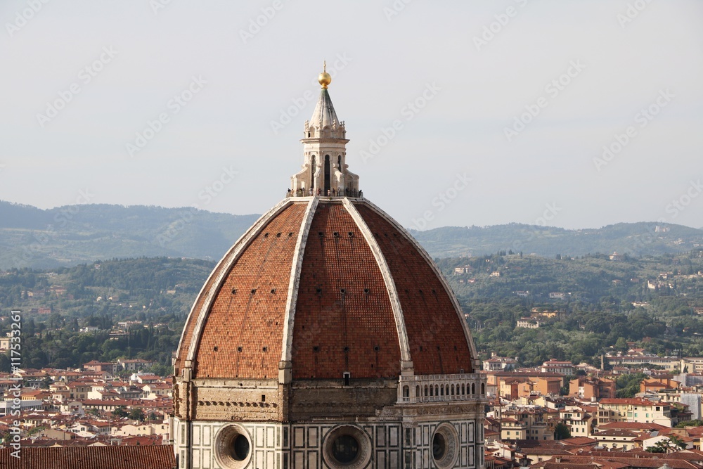 View from Palazzo Vecchio to Cupola of Cathedral Santa Maria del Fiore with tourists on the viewing platform, Florence Italy 