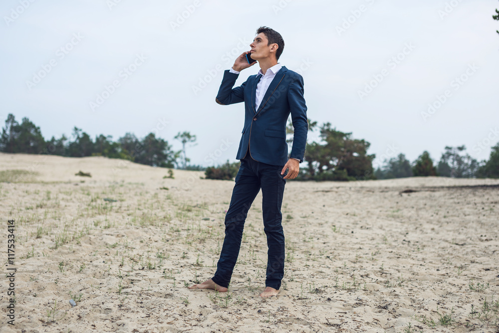young businessman talking on the phone young businessman talking on the phone