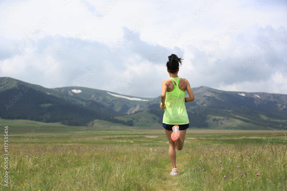 healthy lifestyle young fitness woman runner running on grassland healthy lifestyle young fitness woman runner running on grassland