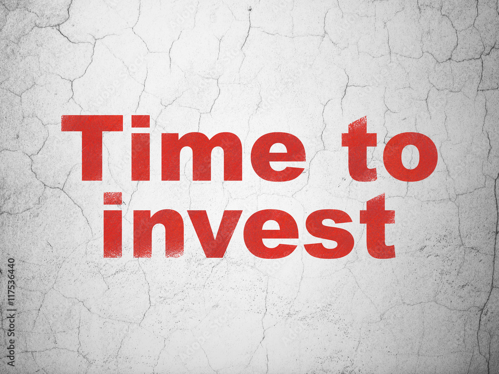 Time concept: Time To Invest on wall background Time concept: Time To Invest on wall background