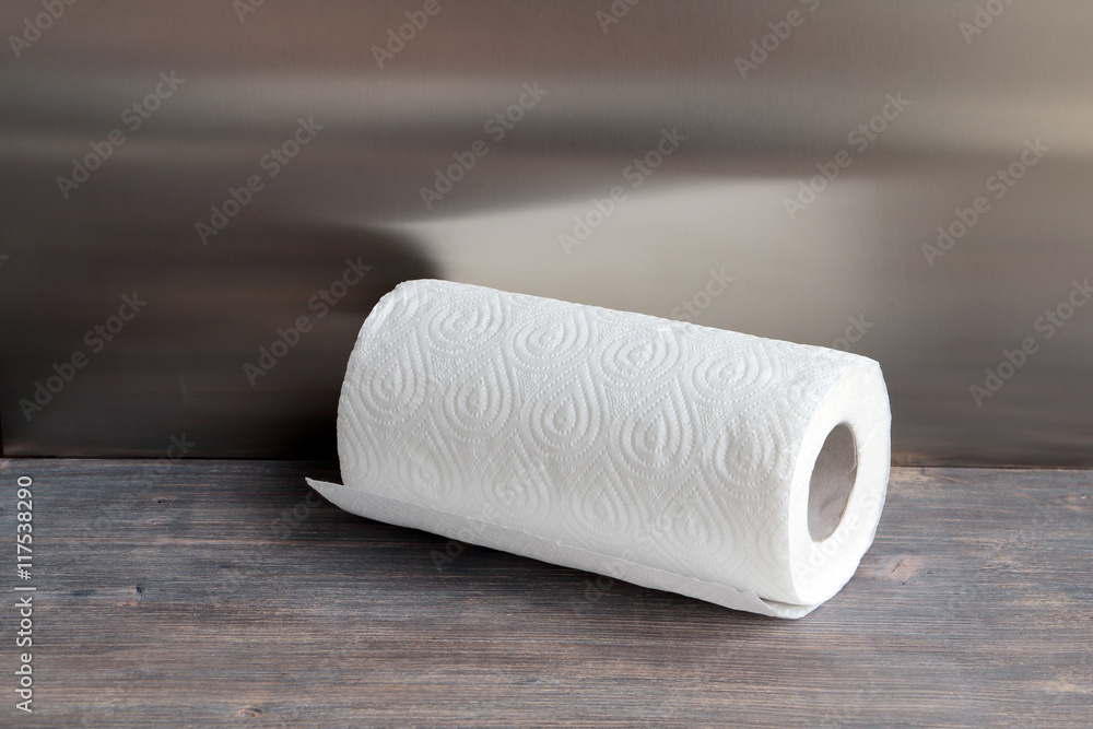 Fototapeta premium White kitchen paper towel on wooden table