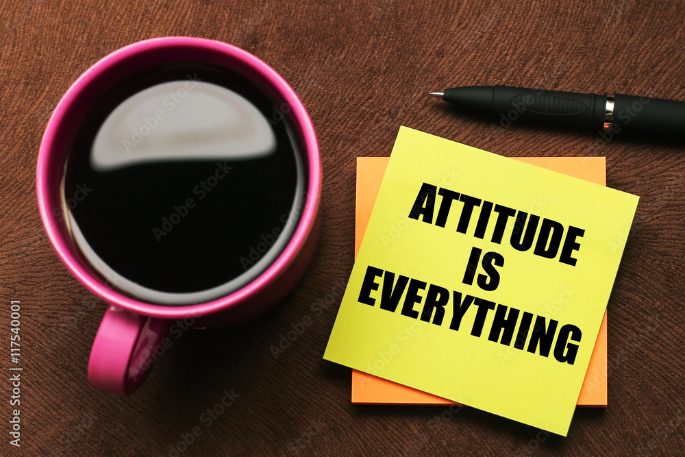 attitude is everything - motivational slogan on a color sticky note with a cup of coffee attitude is everything - motivational slogan on a color sticky note with a cup of coffee