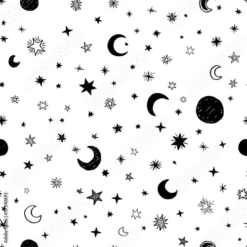 Seamless pattern with handdrawn stars and moons. Doodle vector illustration.