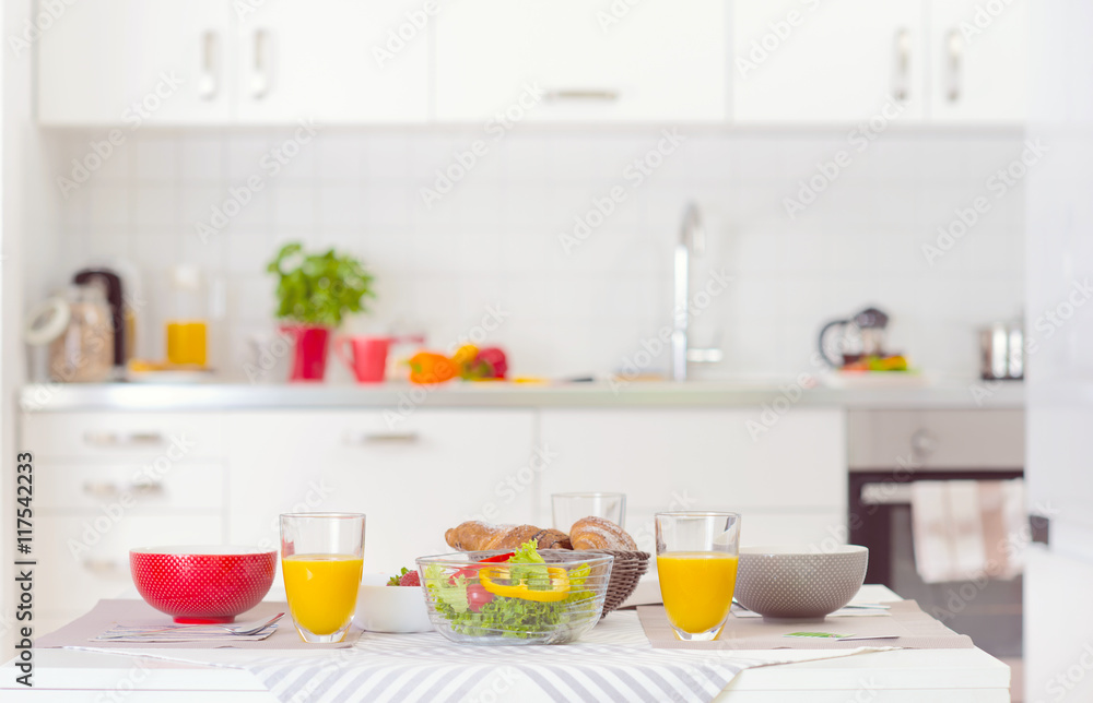 Fototapeta premium Halthy breakfast on table in white kitchen