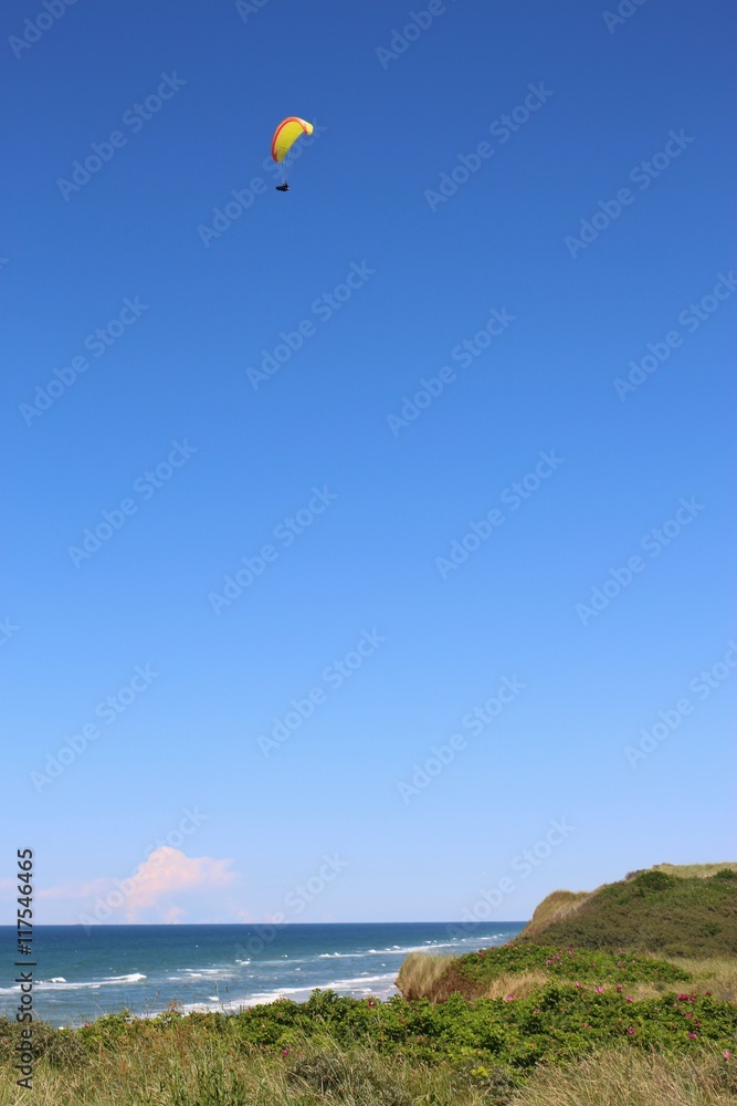 Paragliding in Denmark. Above the shore in North Jutland, between Lokken and Lonstrup. Paragliding in Denmark. Above the shore in North Jutland, between Lokken and Lonstrup.